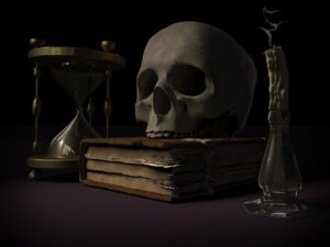 Sablier symbolisant le temps qui passe, un crâne humain posé sur un livre, une bougie éteinte.